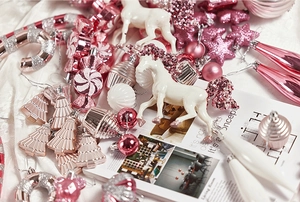 Detailed view of pink and white assorted Christmas ornaments with glitter and candy shapes