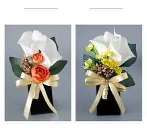 Detailed comparison of white calla lily boutonnieres with orange rose and silk ribbons