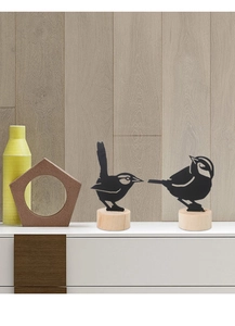 Detail of bird silhouette note holders with black metal finish and natural wood bases
