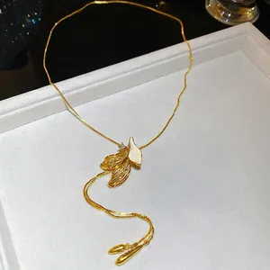 French retro gold leaf necklace with white enamel inlay and zircon on velvet tray