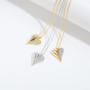 Three split heart necklaces in gold and silver with white zircon pavé on fine chains