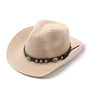 Detail of straw cowboy hat with leather band featuring turquoise stones and silver rivets