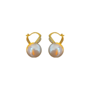 Elegant gold plated pearl earrings with sparkling diamond studs on white background