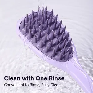 Ergonomic purple silicone scalp massager brush for hair washing with water droplets