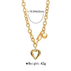 Detail of gold chunky chain necklace with hollow heart pendant and OT clasp, 42cm length