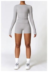 Detail shot of light grey high-elastic brushed yoga set with long sleeve top and shorts