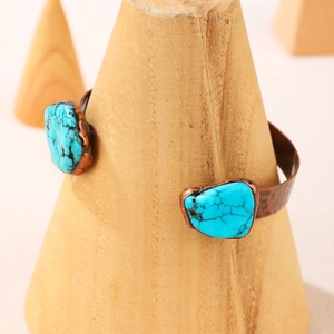 Vintage bronze hammered open cuff bracelet featuring irregular turquoise stones