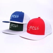 Close-up of lightclub embroidery on blue black and red mesh trucker baseball caps