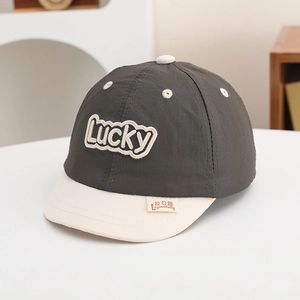 Detailed view of kids lucky baseball cap featuring 3D embroidery and soft brim