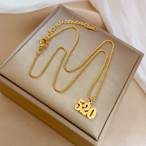 Detail of 18K gold-plated 520 pendant on a bead chain with S925 clasp hallmark