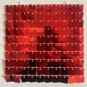 Detail of red square sequins for wind-driven party backdrop with reflective mirror finish