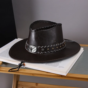 Detail of dark brown leather cowboy hat featuring a metal bull head buckle and star studs