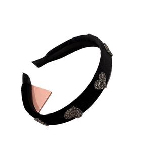 Elegant black velvet headband with sparkling rhinestone heart accents for women