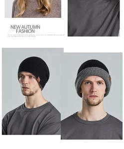 Detail view of a double-sided knit beanie in black and grey for autumn and winter warmth