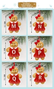 Detailed size view of six cute felt gingerbread man ornaments with letters on pine branches