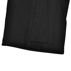 Close-up of high-quality black knit fabric texture and durable stitching on evening dress