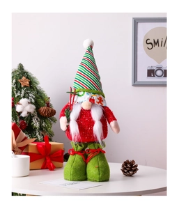 Close-up of Nordic Christmas gnome featuring a striped hat and red knitted sweater