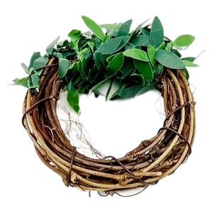 Handcrafted brown rattan napkin ring with realistic green artificial leaves decor