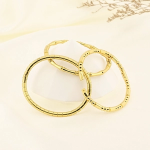 Polished 18K gold-plated stainless steel bamboo and geometric textured cuff bracelets