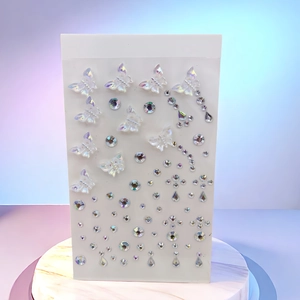 Detail of iridescent butterfly stickers and AB rhinestones on a marble display base