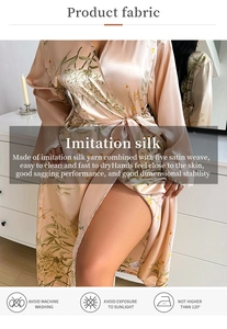 Detailed fabric texture of champagne silk robe with green floral patterns and satin weave