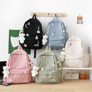 Pastel canvas school backpacks in five colors with cute bear pendants and badges