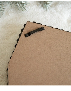 Detail of metal sawtooth hanger on MDF backboard for Christmas wall decorations