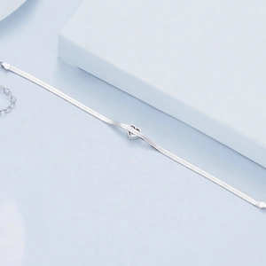 Sparkling S925 sterling silver snake chain bracelet with a hollow heart pendant