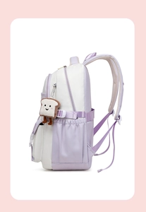 Detail view of purple school backpack showing side water bottle pocket and toast plush charm