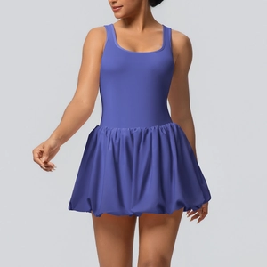 Detail of purple sleeveless tennis bodysuit dress showing moisture-wicking fabric and pleated skirt
