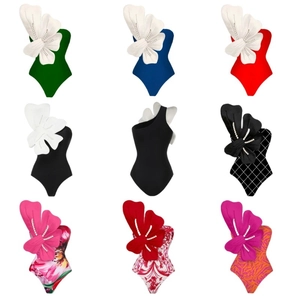 Set of 2024 one-shoulder monokinis with large 3D floral accents and pearl details