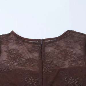Detail of brown floral lace fabric featuring intricate hollow texture and hidden back zipper
