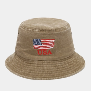 Close-up of USA embroidery and flag on washed khaki vintage bucket hat with eyelets