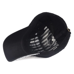 Black baseball cap with rhinestone crown design showing interior detail and shape