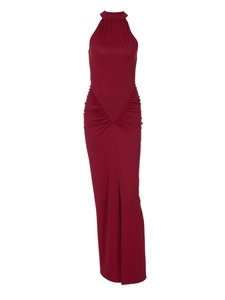 Detail of elegant dark red high neck evening dress with side slit and waist ruching