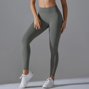 Detail of high-waisted seamless yoga pants in dark grey with a sculpting V-waistband
