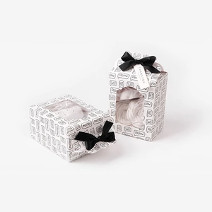 Foldable white gift box with PVC window and black ribbon bow for candies or toys