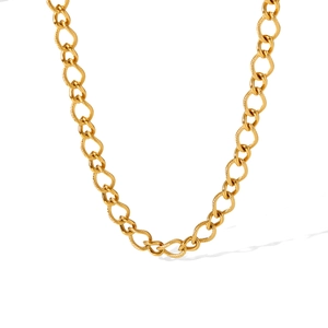 Detailed close-up of gold chunky link chain with spiral texture and polished finishes
