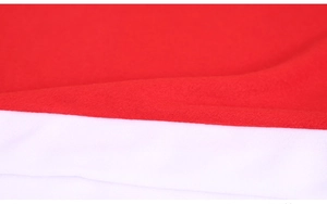 Close-up of red and white polar fleece fabric texture on a Christmas chair cover