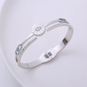 Double-layered spring open cuff bracelet with evil eye design and white cubic zirconia