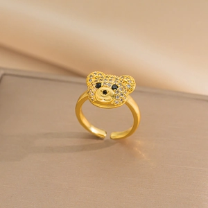 Adjustable gold bear ring featuring shimmering cubic zirconia with black gemstone eyes