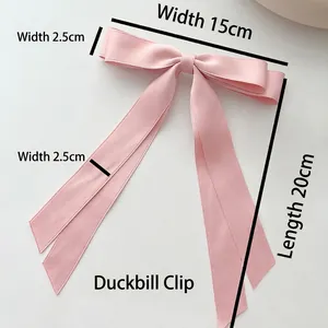 Pink double-layered bow hair clip with long ribbons and metal duckbill clip