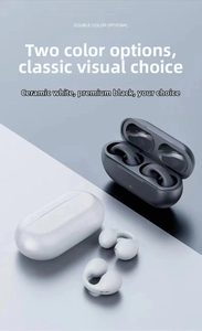 Modern clip-on Bluetooth earbuds in black and white colors with oval charging cases
