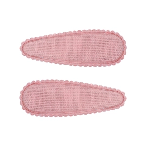 Détail de barrettes à cheveux roses en tissu à bords festonnés pour filles et enfants