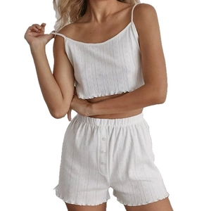 Three-piece white loungewear set with heart-dot texture and ruffled hem details