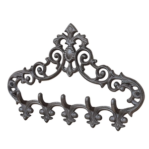 European vintage cast iron wall rack with ornate scroll patterns and five hanging hooks