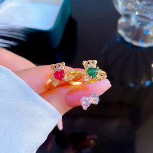 Gold plated open bear rings set with red and green heart stones and zircons