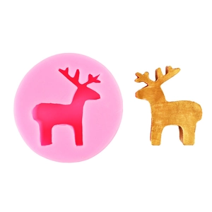 Detail of pink silicone deer mold showing the hollow design and a gold deer finished product
