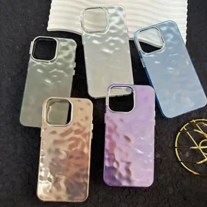 Close-up of 3D ripple texture iPhone cases in metallic silver, gold, and purple finishes