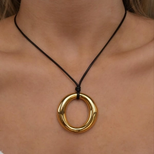 Vintage stainless steel heart pendant on wax cord necklace worn by model